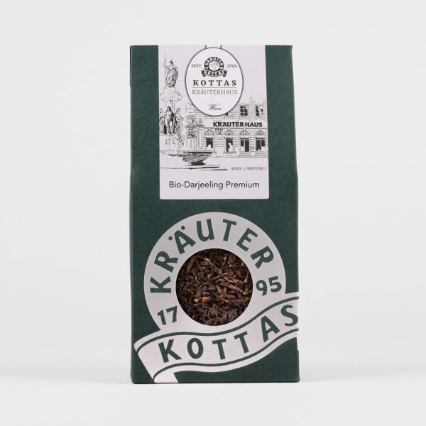 Dunkelgrüne Verpackung mit KOTTAS Kräuterhaus Bio-Darjeeling Premium Schwarztee