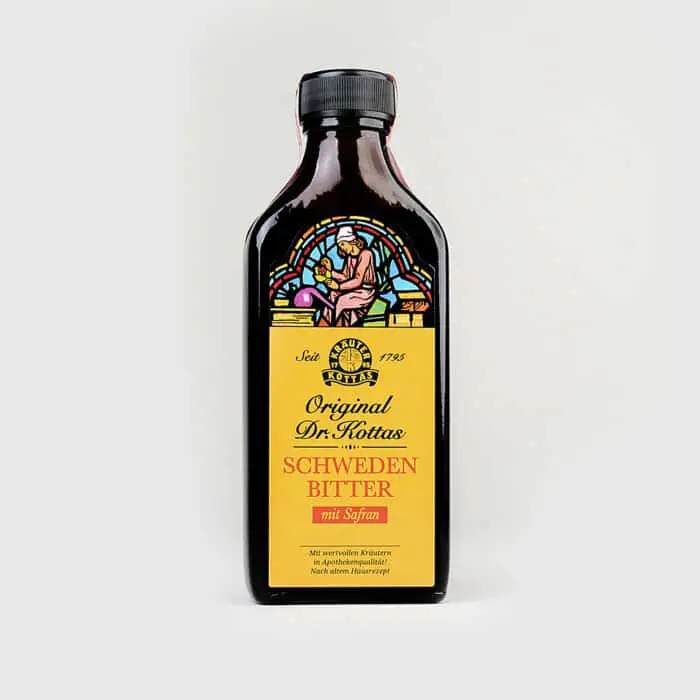 A dark bottle of DR. KOTTAS herbal bitters which aids digestion.