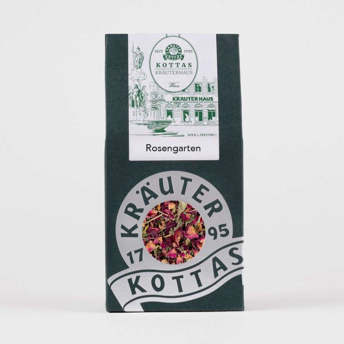 Eine grüne Teepackung von KOTTAS Rosengarten Tee, mit Blick auf die rosa Kräuter- und Blumenmischung.