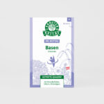 Eine Packung DR. KOTTAS Basen Kräutertee im Filterbeutel mit hellvioletten Kräuterillustrationen